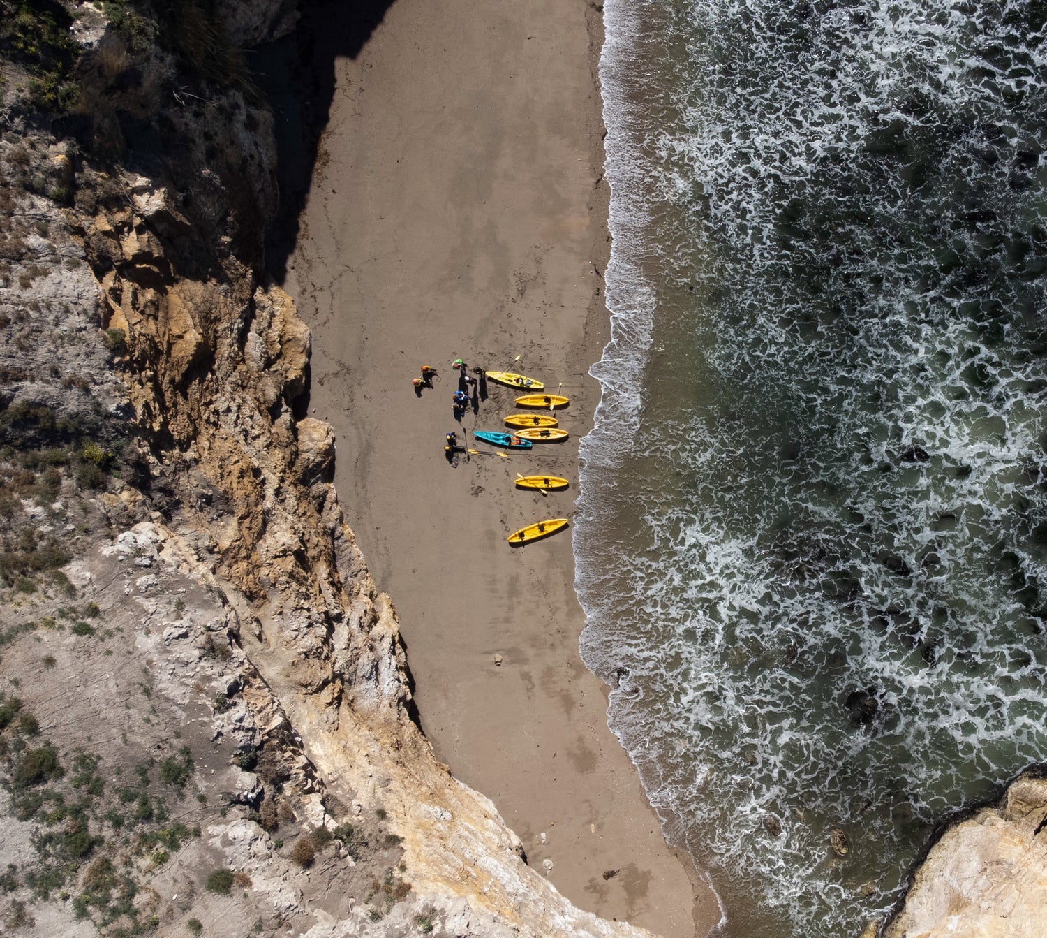 Drone shot of kayakers on a beach